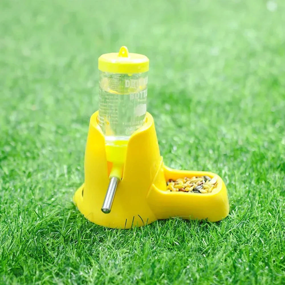 Small pet water feeder bottle and food dish for Burrowly habitat setup.