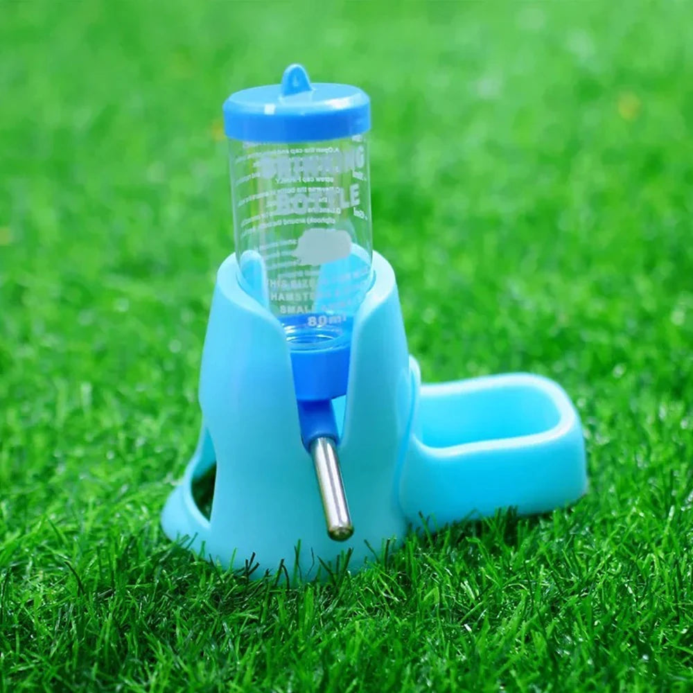 Small pet water feeder bottle and food dish for Burrowly habitat setup.